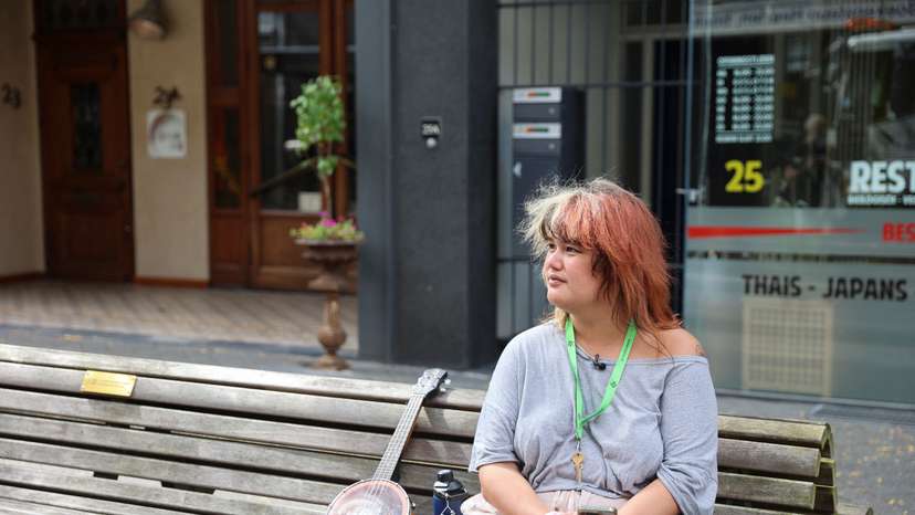 Veronica Clifford Carlos, a U.S. trans woman seeking asylum in the Netherlands, sits on a bench in Heerlen