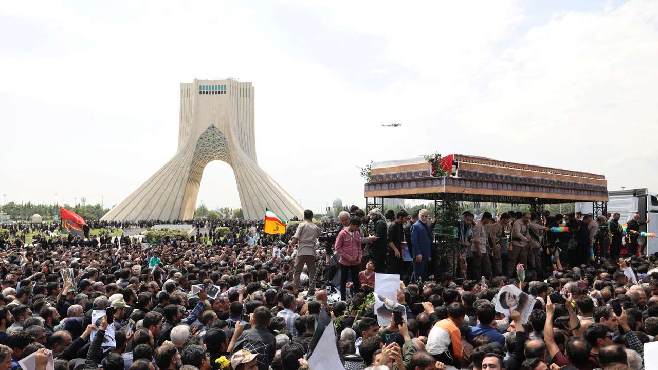 Mourners attend a funeral for victims of the helicopter crash that killed Iran's President Ebrahim Raisi, in Tehran