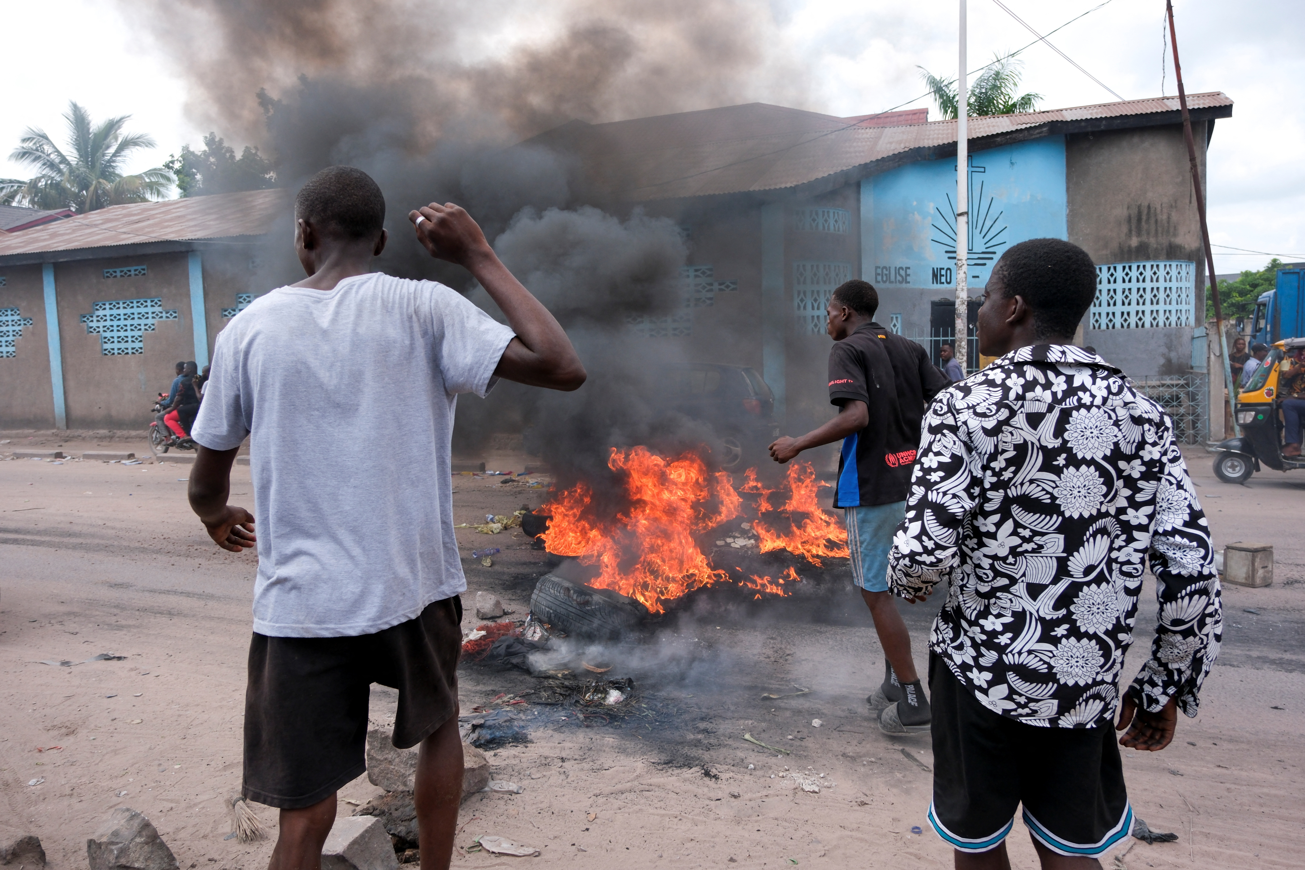 Protesters burn tires and other objects during demostration in Kinshasa