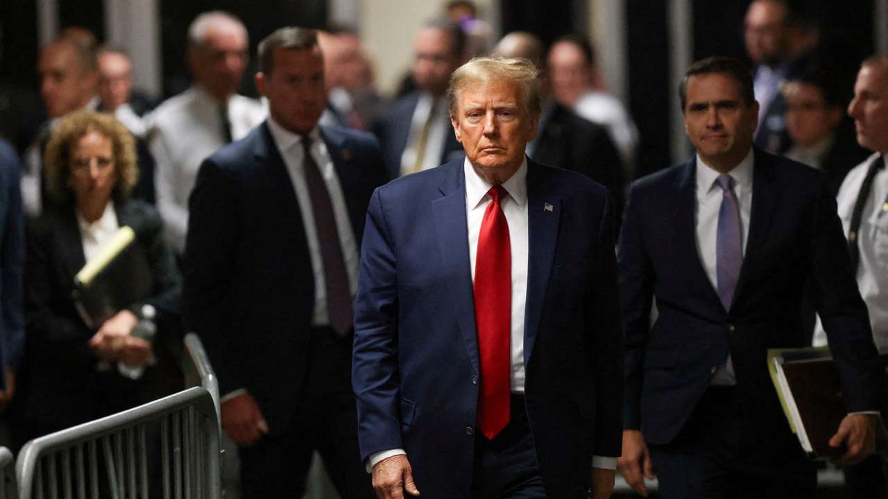 FILE PHOTO: Former U.S. President Trump attends a hearing on a criminal case linked to a hush money payment, in New York City