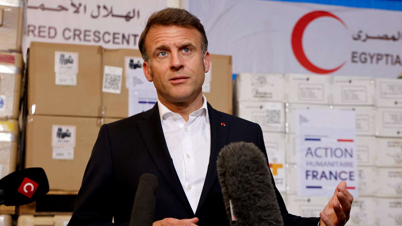 France's President Macron speaks in front of humanitarian aid destined to Gaza, in Arish
