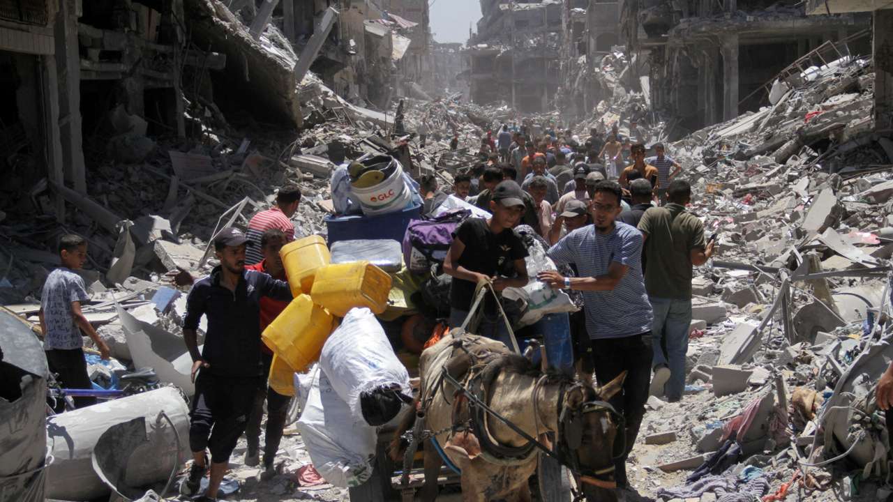 Palestinians inspect the damage after Israeli forces withdrew from Jabalia refugee camp