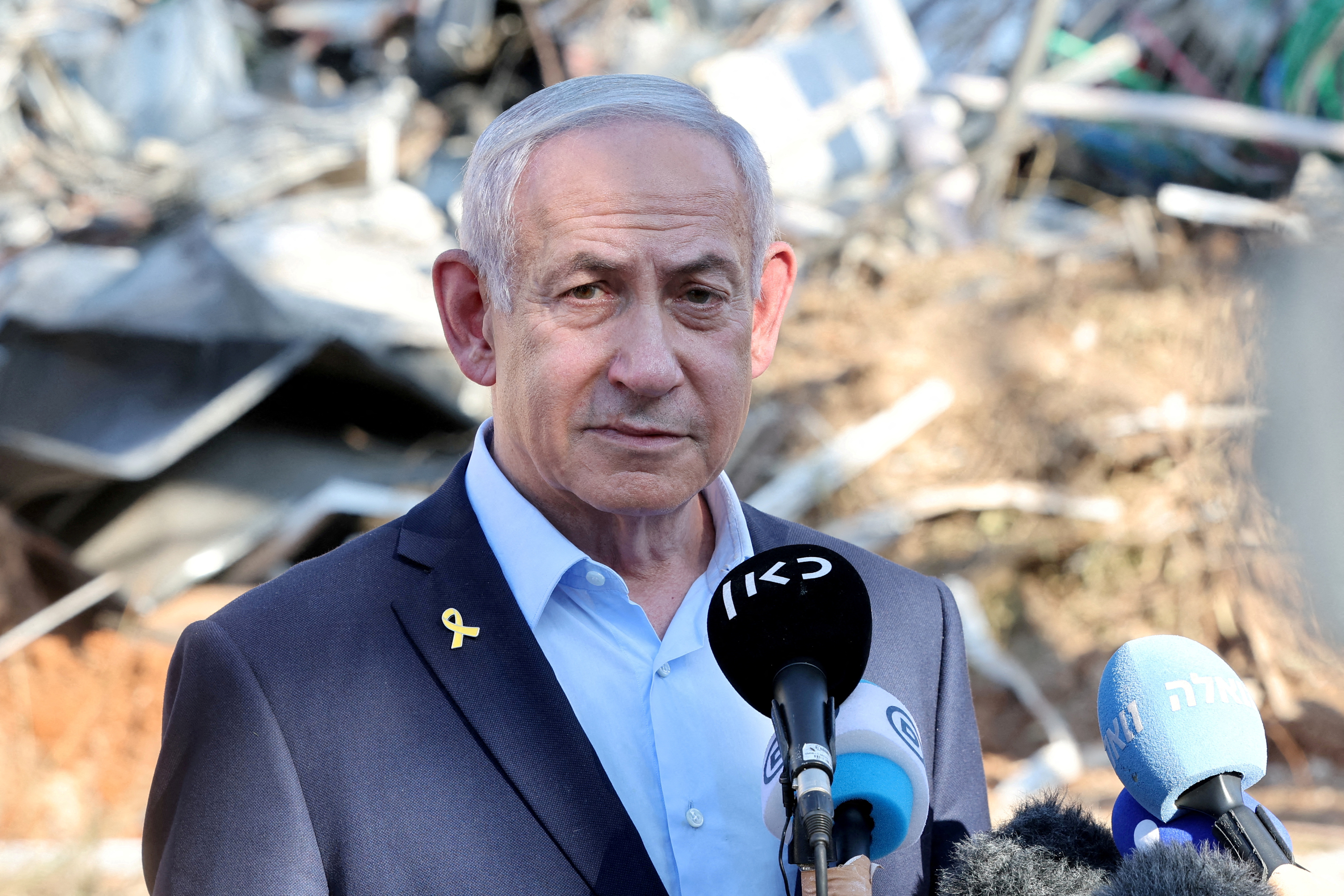 FILE PHOTO: Israel's Prime Minister Benjamin Netanyahu gives a statement during a visit to the site of the Weizmann Institute of Science, which was hit by an Iranian missile barrage, in Rehovot