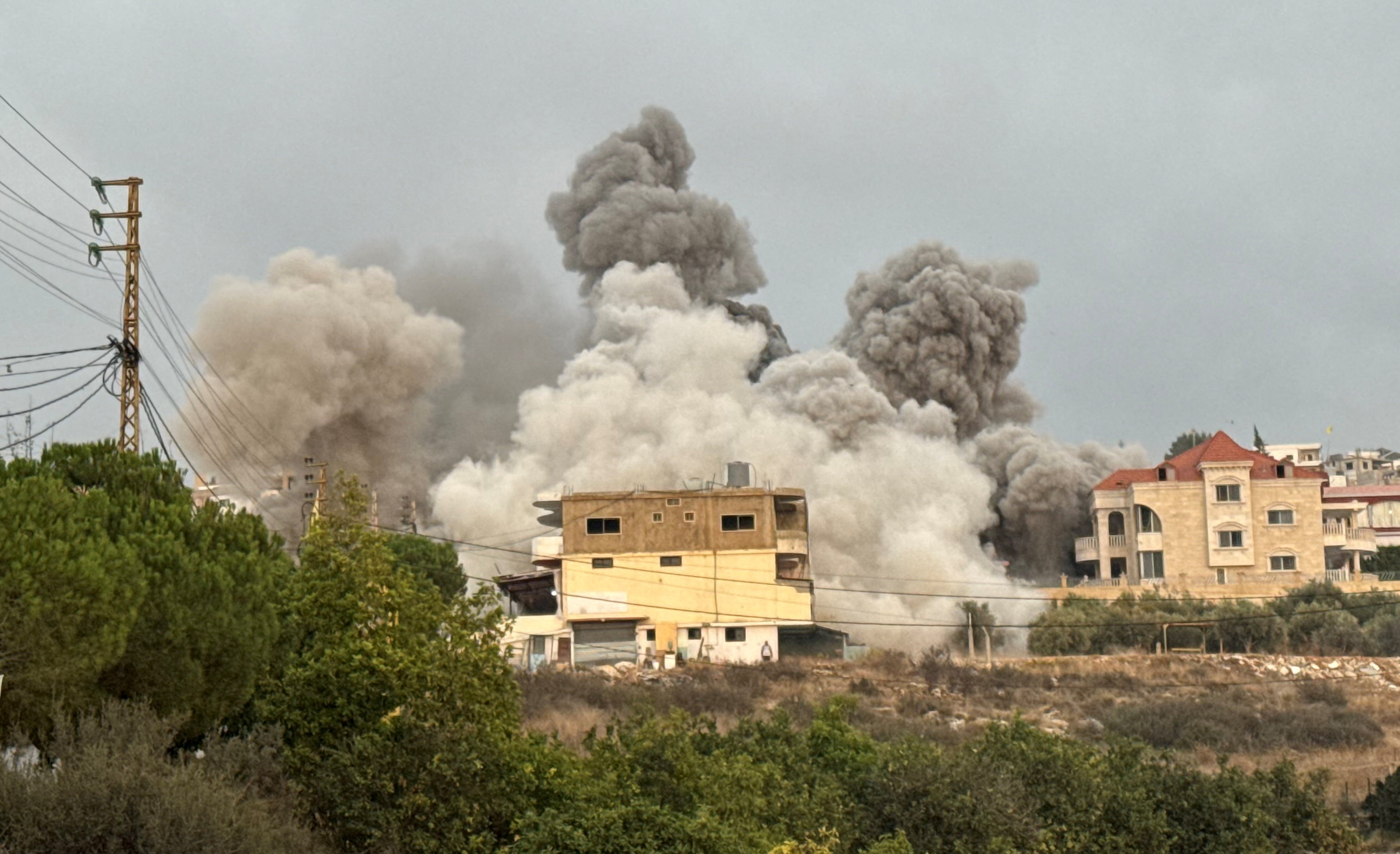 Smoke rises after Israeli strikes following Israeli military's evacuation orders, in Tayr Debba