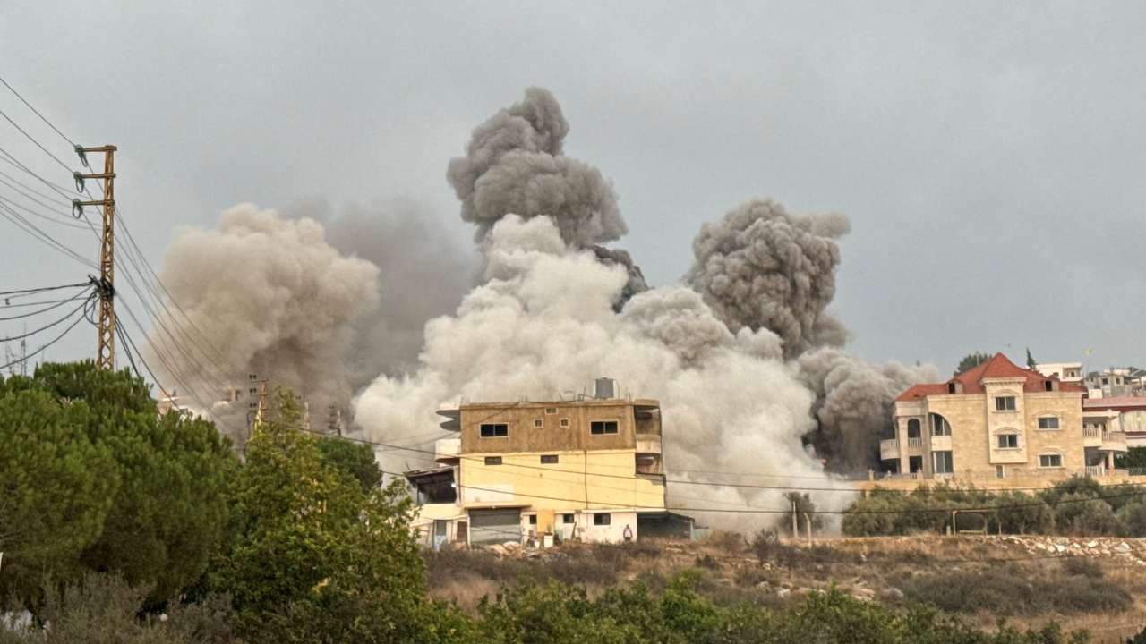 Smoke rises after Israeli strikes following Israeli military's evacuation orders, in Tayr Debba