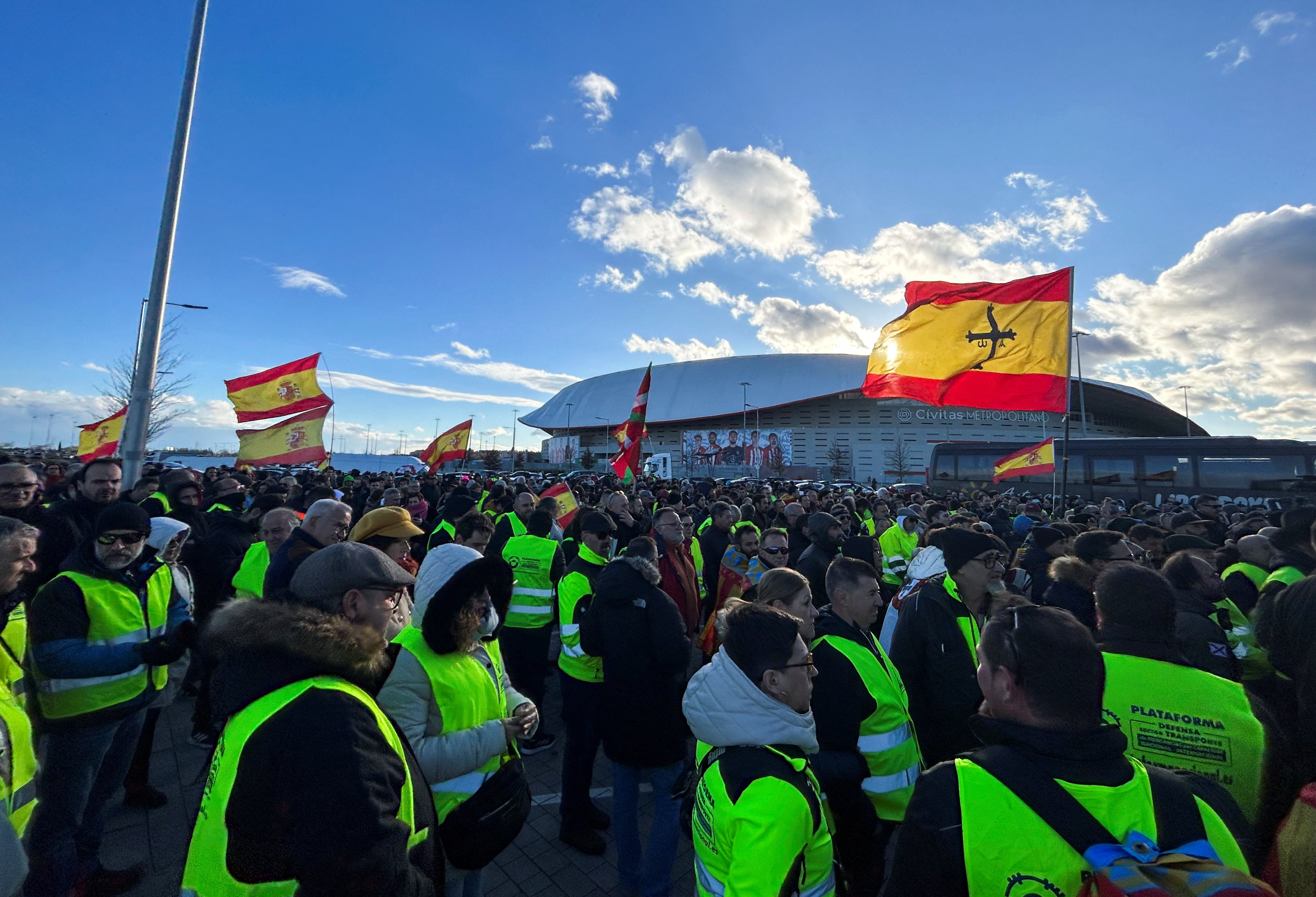Farmers and truck drivers gather outside Atletico Madrid stadium to vote a strike in both sectors during a fifth day of protests across the country, in Madrid