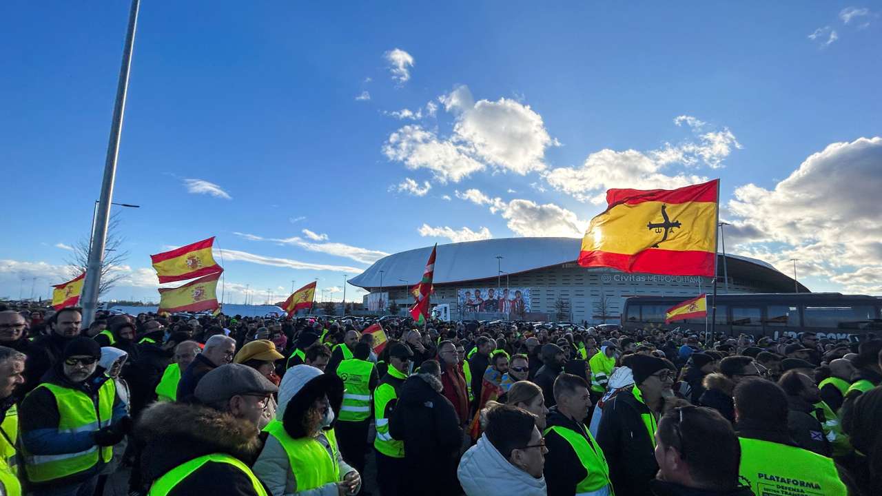 Farmers and truck drivers gather outside Atletico Madrid stadium to vote a strike in both sectors during a fifth day of protests across the country, in Madrid