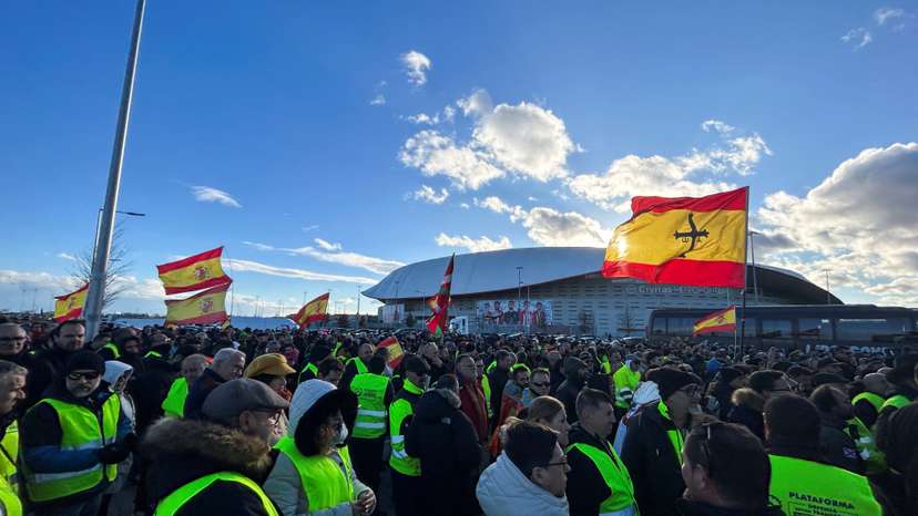 Farmers and truck drivers gather outside Atletico Madrid stadium to vote a strike in both sectors during a fifth day of protests across the country, in Madrid
