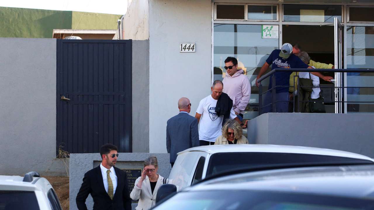 Members of the United States and Australian embassies and the parents of missing U.S. and Australian tourists leave the Forensic Medical Service in Ensenada