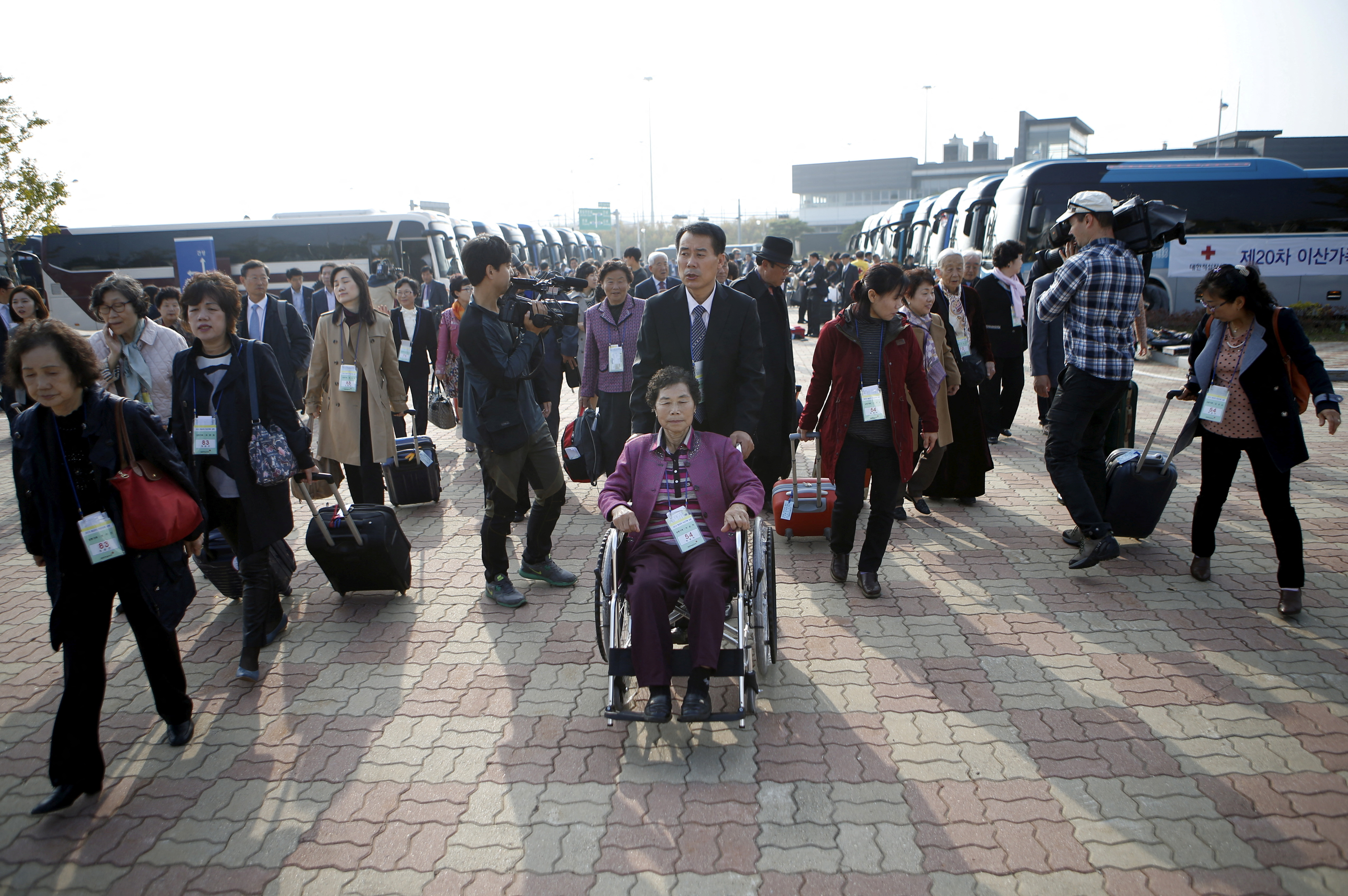 FILE PHOTO: South Korean participants for a reunion arrive at the South's CIQ in 2015