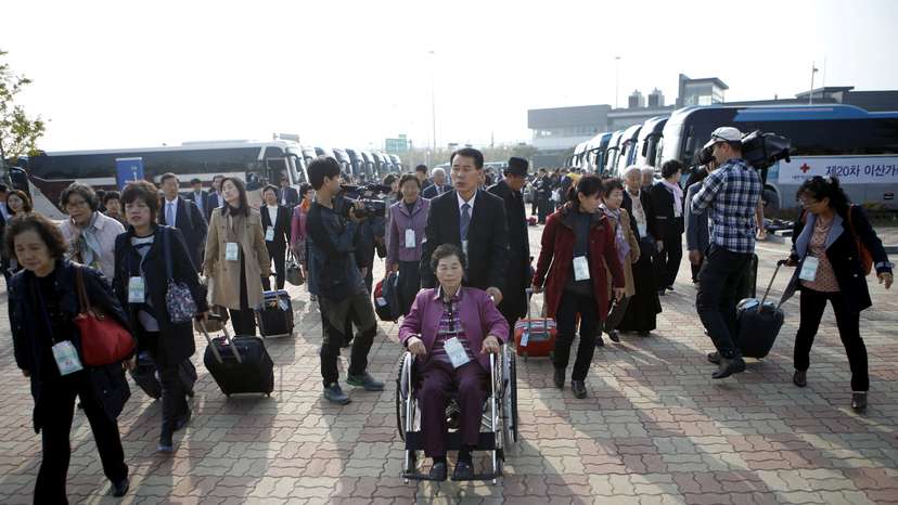 FILE PHOTO: South Korean participants for a reunion arrive at the South's CIQ in 2015