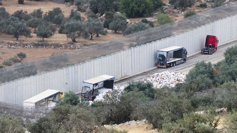 Trucks carrying aid to Gaza stand damaged at checkpoint near Hebron