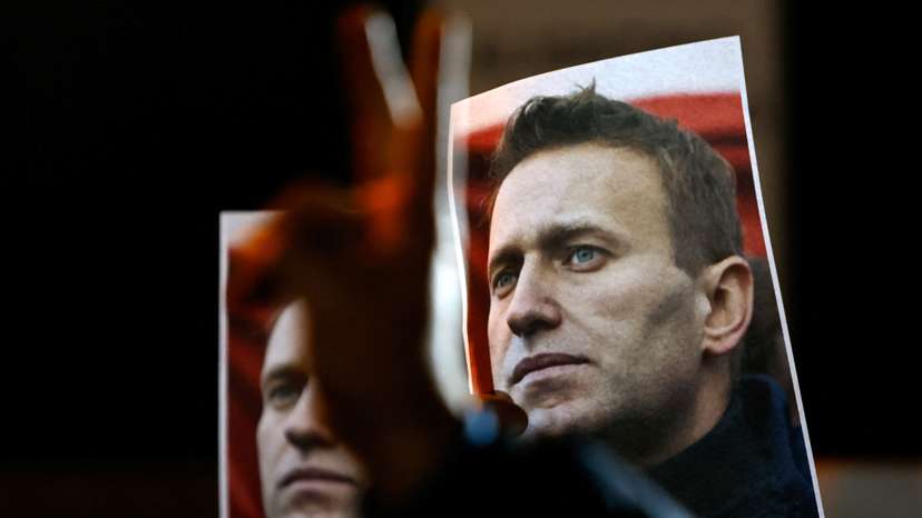 People attend a protest and vigil following the death of Russian opposition leader Alexei Navalny, in Kappara