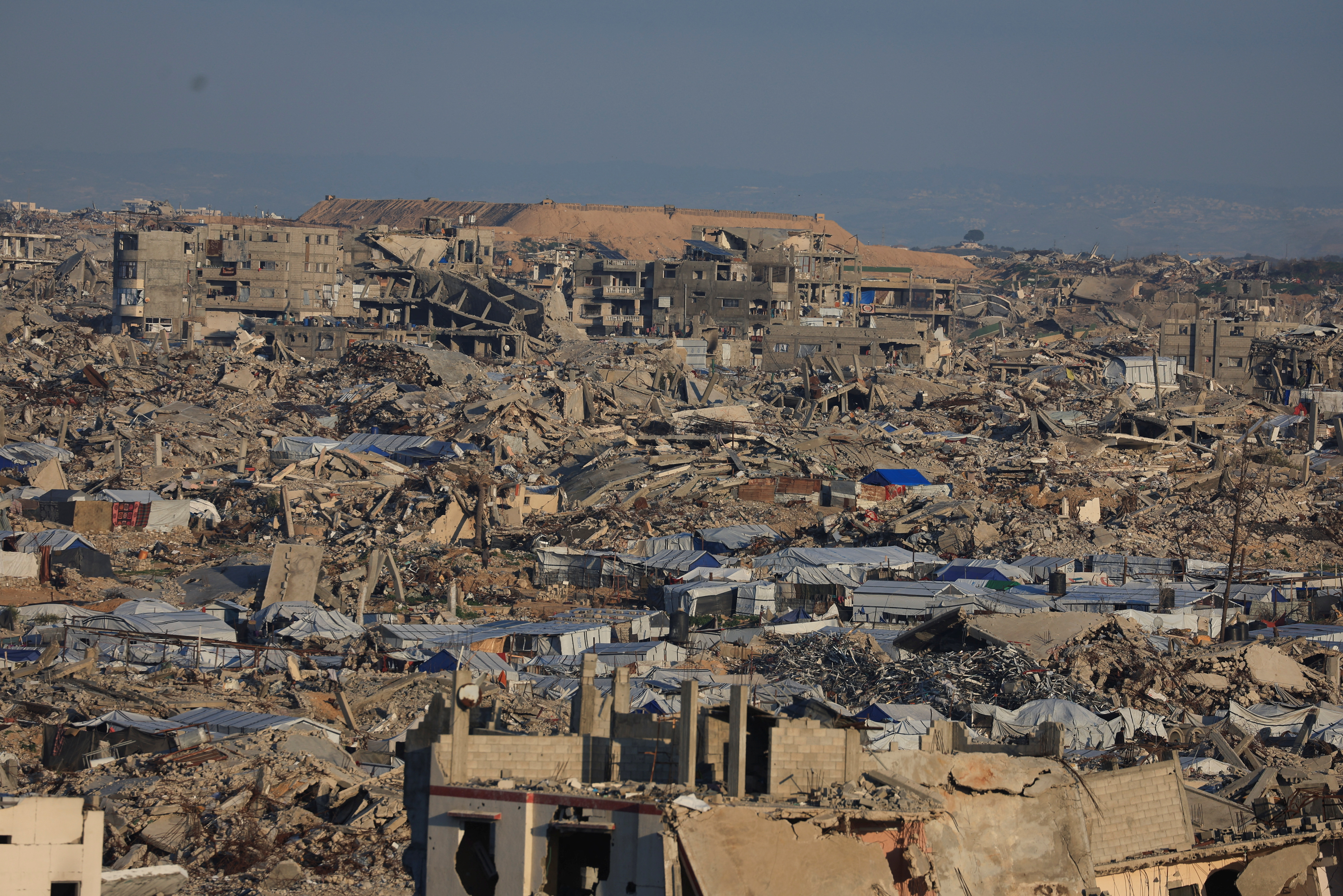 General view of destroyed houses in areas marked by the Israeli military’s yellow line east of Gaza