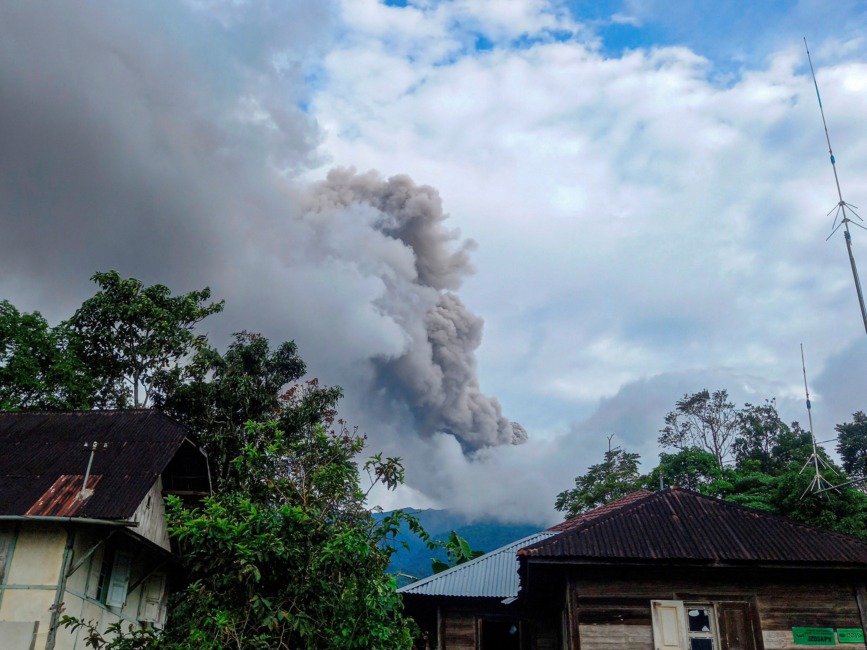 Mount Marapi volcano spews volcanic ash as seen from Nagari Sungai Pua, in Agam