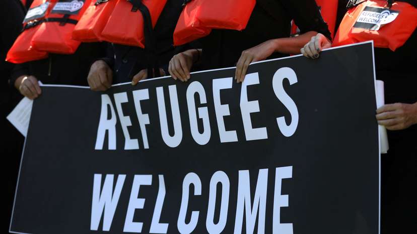 FILE PHOTO: People protest against cuts to the U.S. refugee resettlement program, in Washington