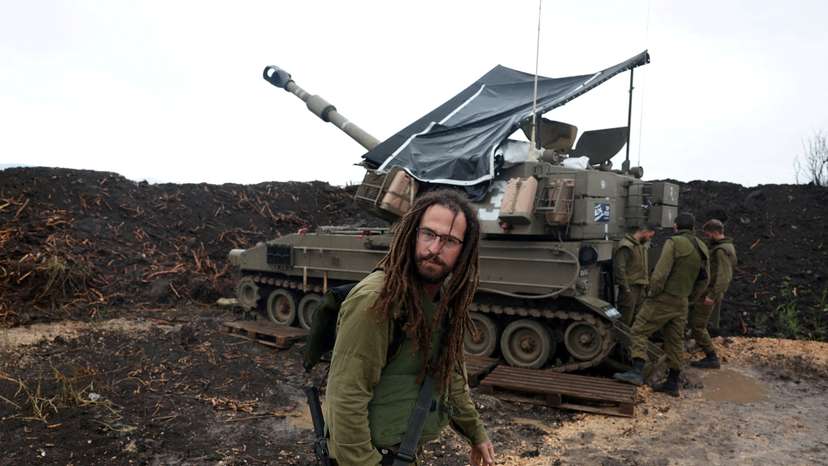 FILE PHOTO: Israeli soldiers stand by near the Israel-Lebanon border