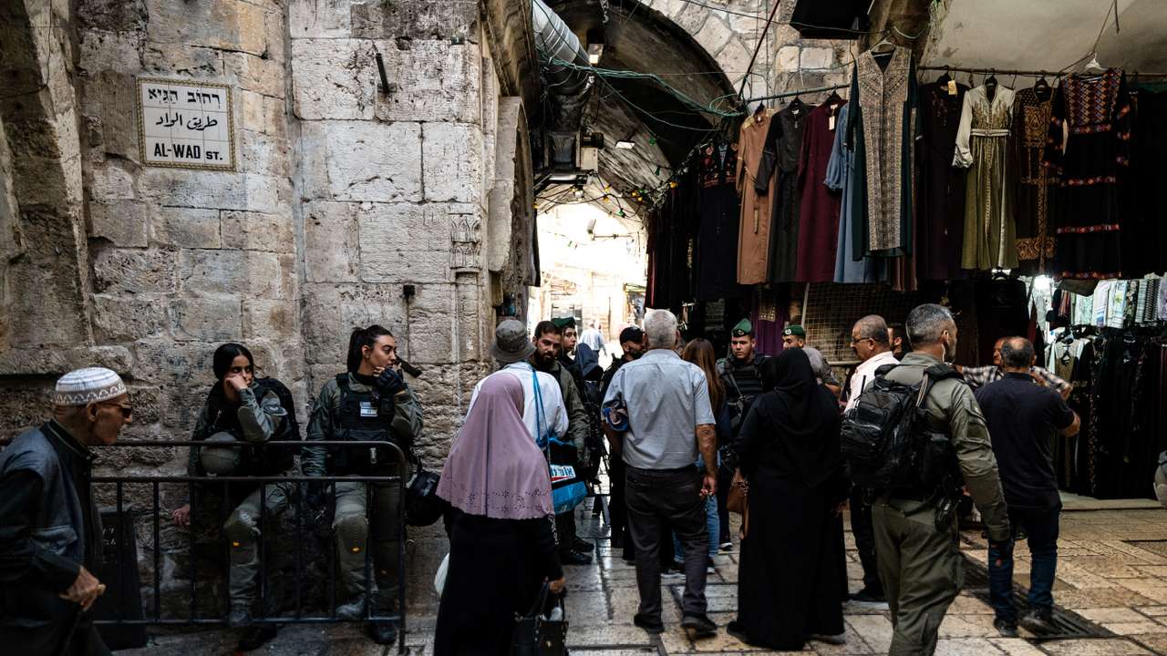 Israeli Border Police check Palestinians before Friday prayers inside Jerusalem's Old City