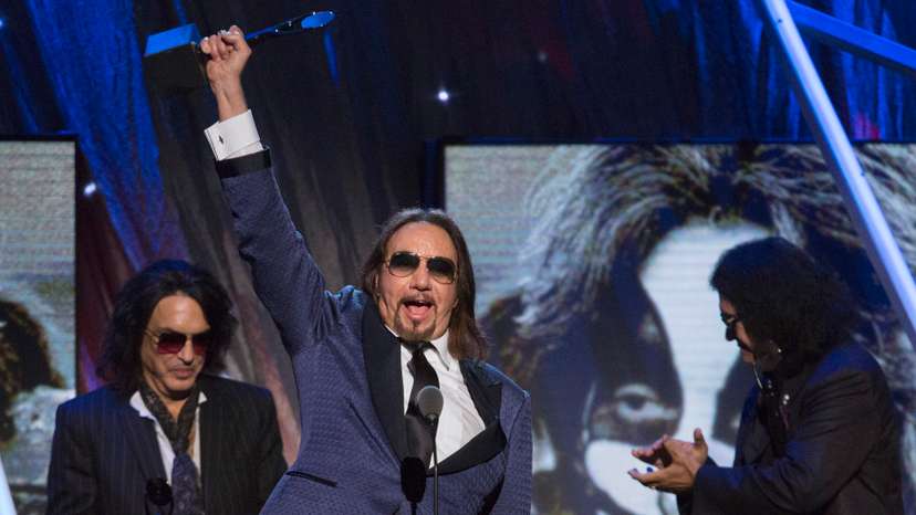Ace Frehley of the band Kiss holds up their award after rock band was inducted at 29th annual Rock and Roll Hall of Fame Induction Ceremony in Brooklyn, New York