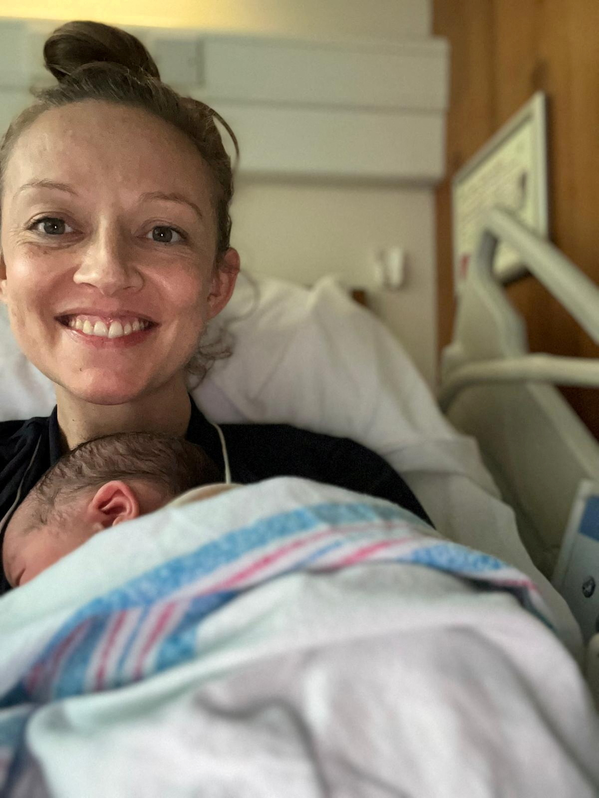 Holly Cairns, leader of Ireland's opposition Social Democrats party, poses with her newborn daughter