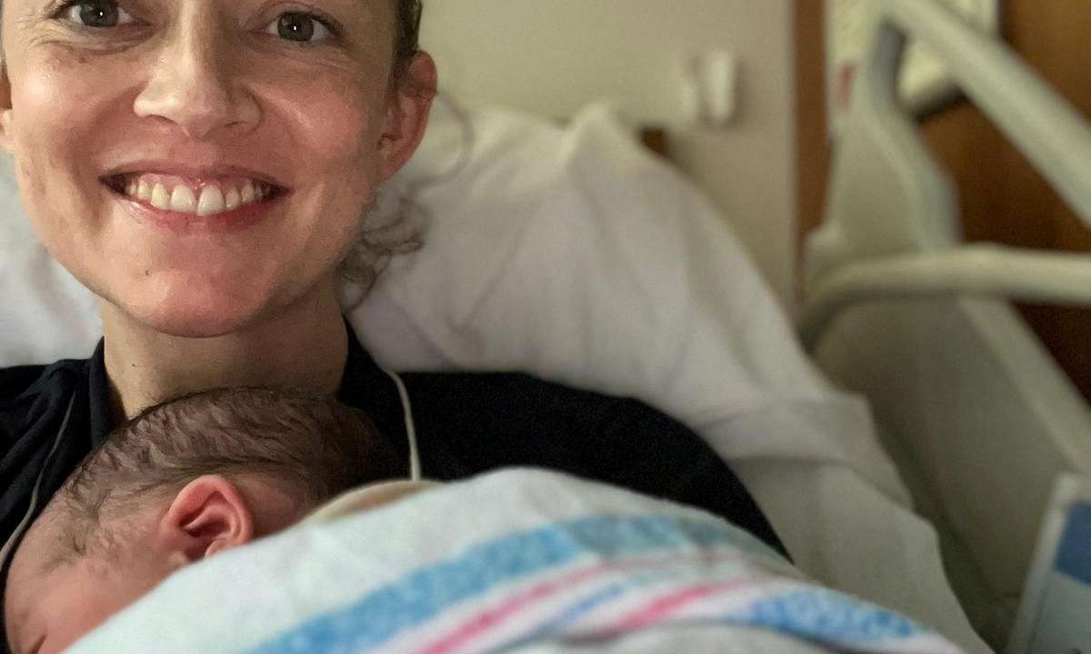 Holly Cairns, leader of Ireland's opposition Social Democrats party, poses with her newborn daughter