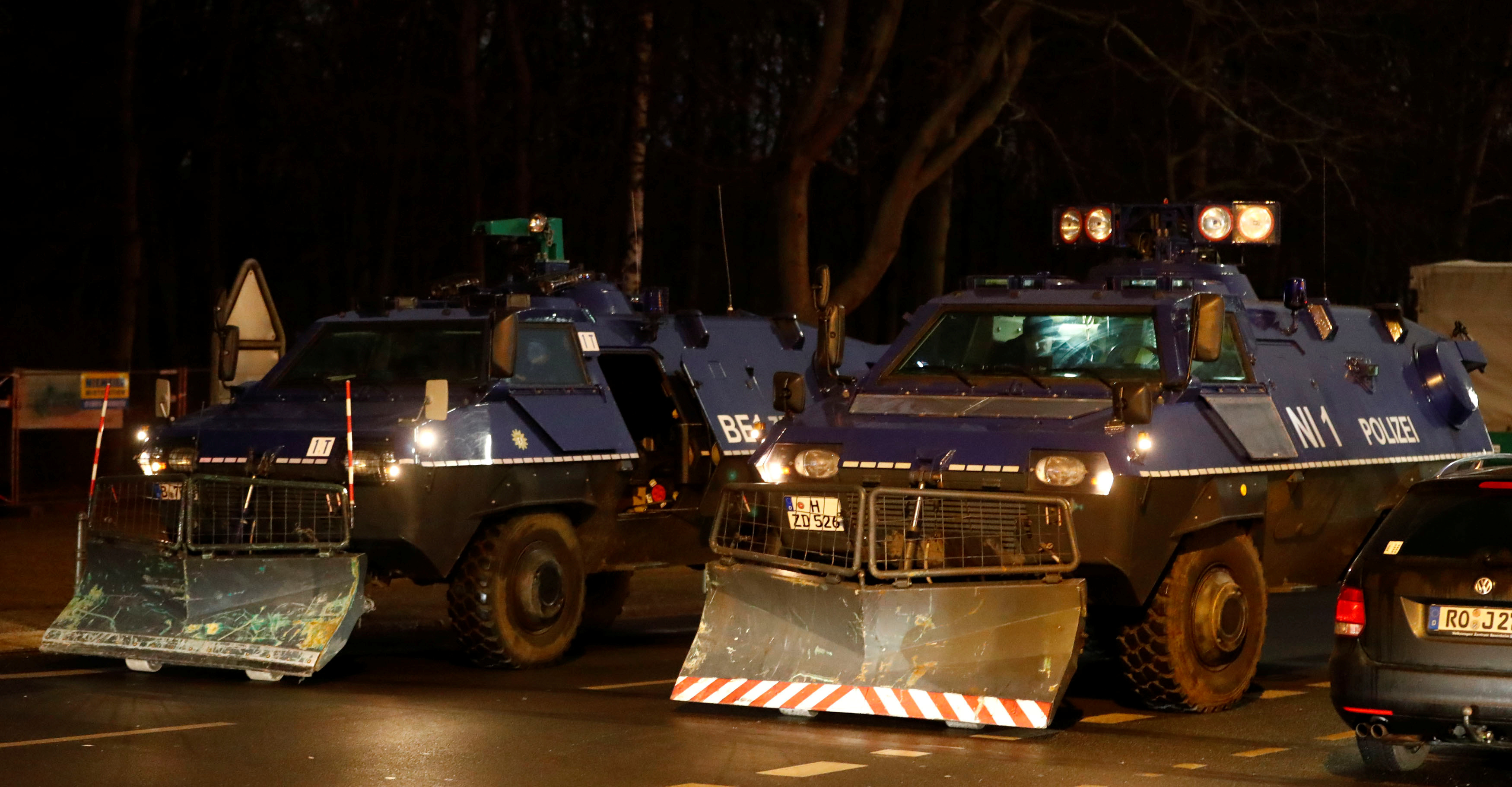Armoured police vehicles are seen near the Brandenburg Gate ahead of New Year's Eve celebrations in Berlin