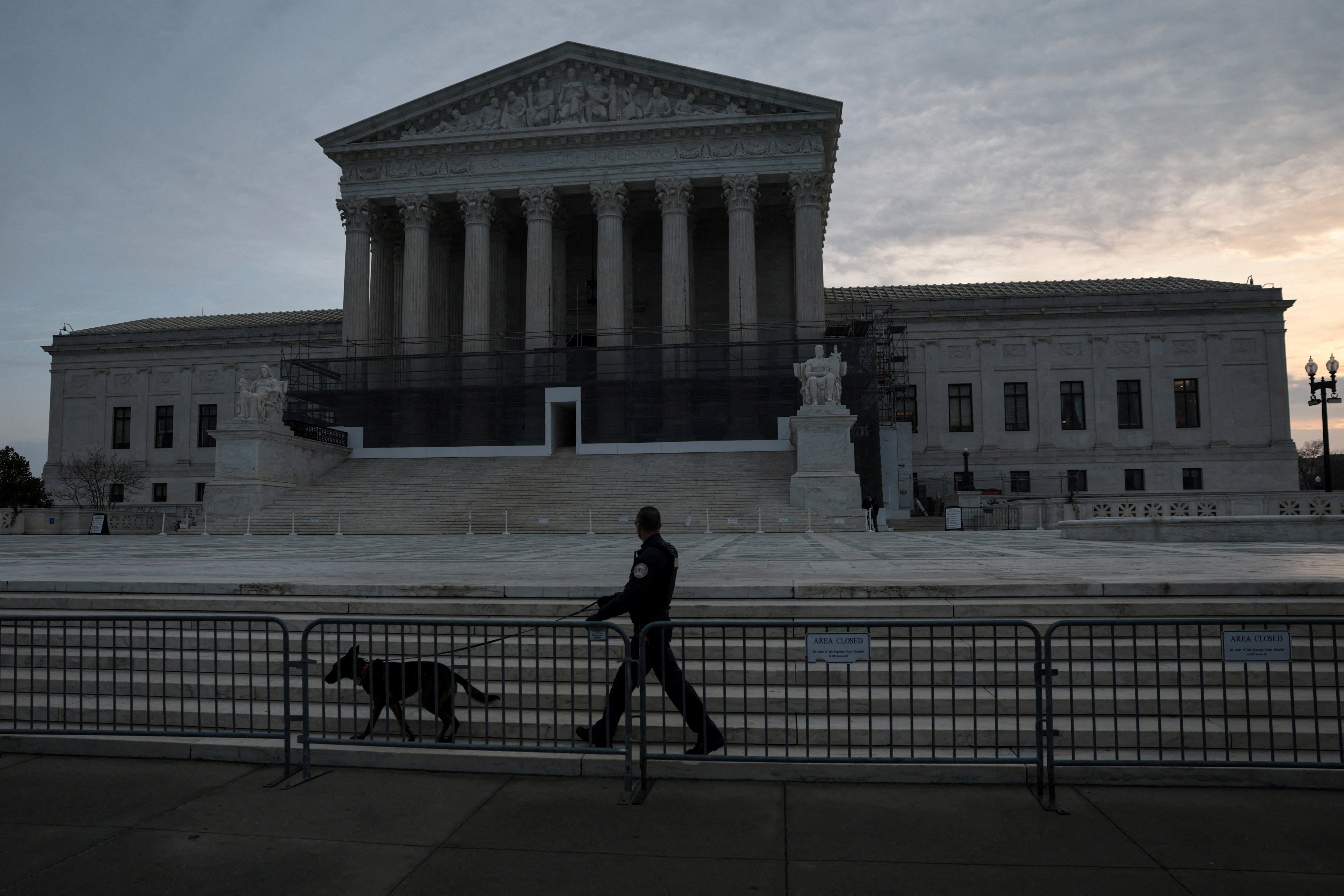 FILE PHOTO: People prepare for the start of the day at the U.S. Supreme Court in Washington