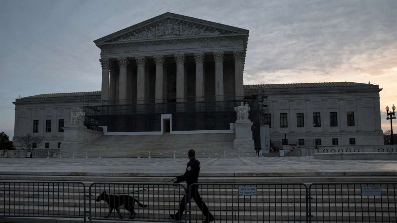 FILE PHOTO: People prepare for the start of the day at the U.S. Supreme Court in Washington