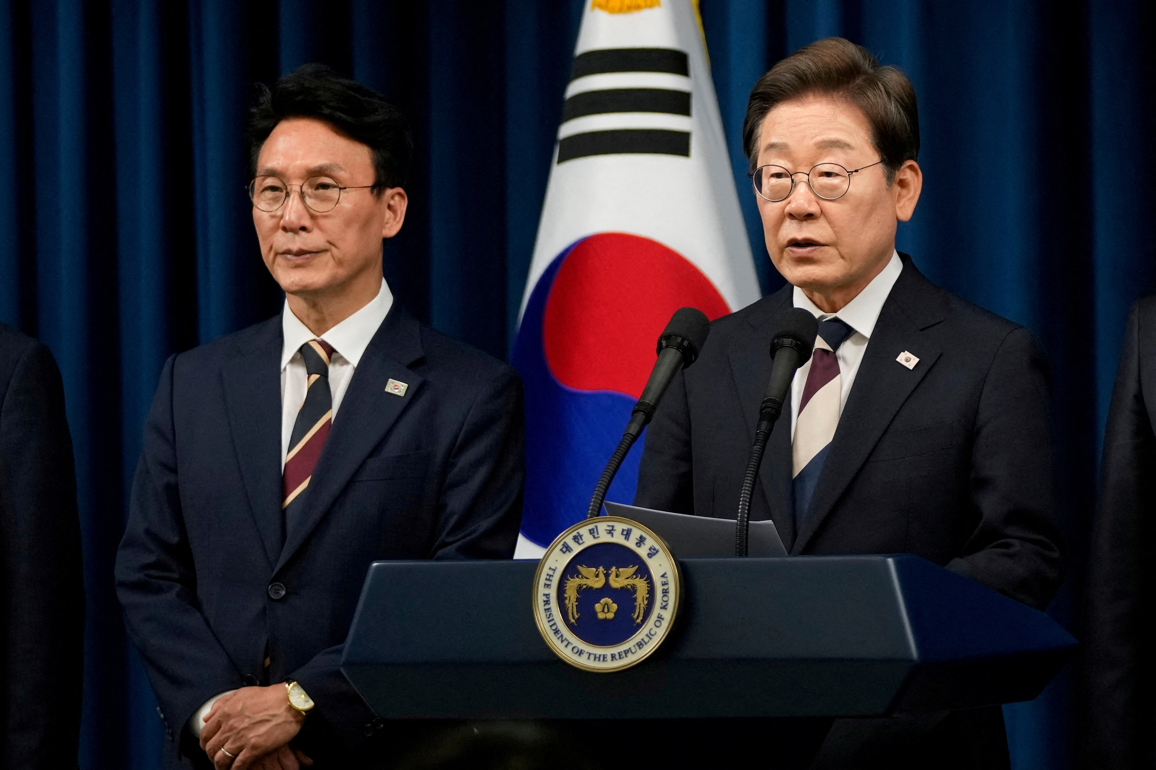 FILE PHOTO: South Korean Prime Minister Kim Min-seok with President Lee Jae Myung in Seoul