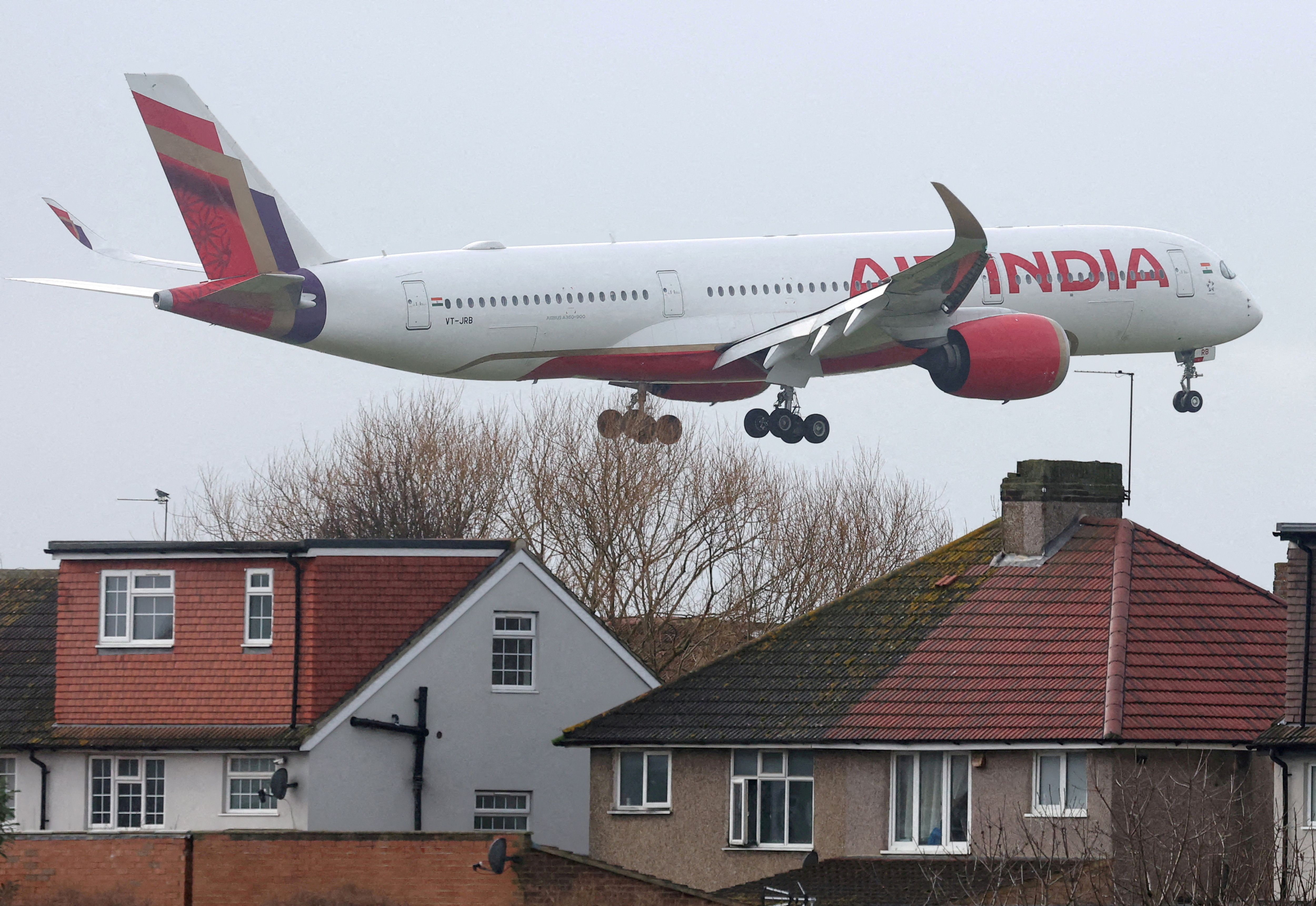 FILE PHOTO: Planes make landing approach to Heathrow Airport in west London