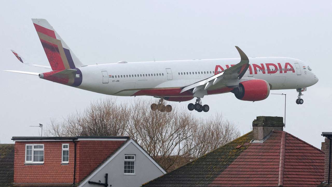 FILE PHOTO: Planes make landing approach to Heathrow Airport in west London