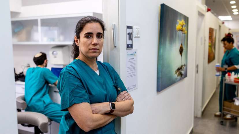 Forensic dentist Esi Sharon-Sagie, who has identified victims of Iranian missile strikes in Israel, victims of Hamas' October 7 attack, hostages and the body of Hamas leader Yahya Sinwar, in her clinic during an interview with Reuters, in Jerusalem