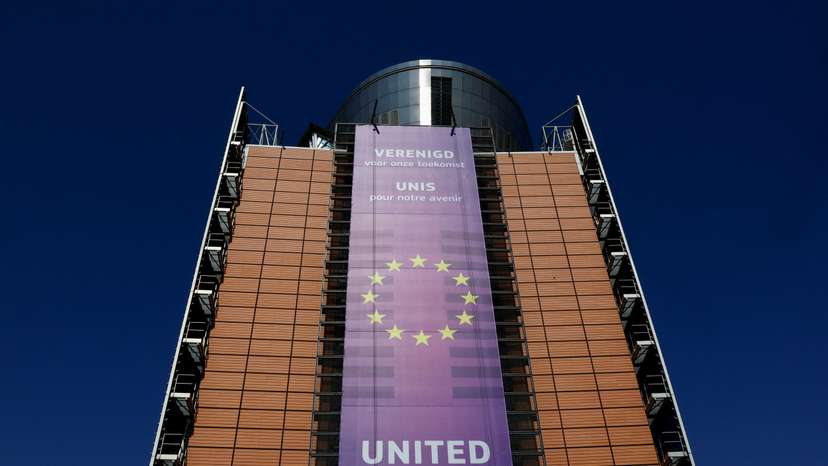 FILE PHOTO: European Union flags flutter outside the European Commission headquarters in Brussels