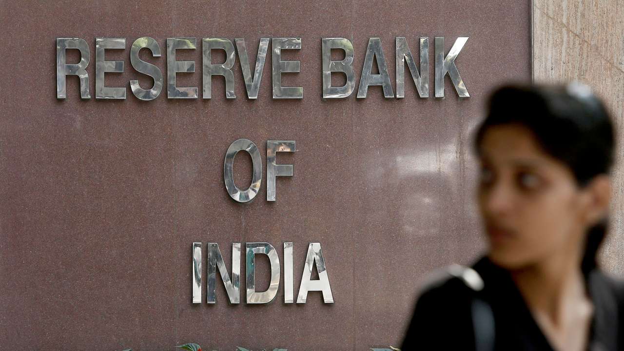 A woman walks past the Reserve Bank of India building in New Delhi