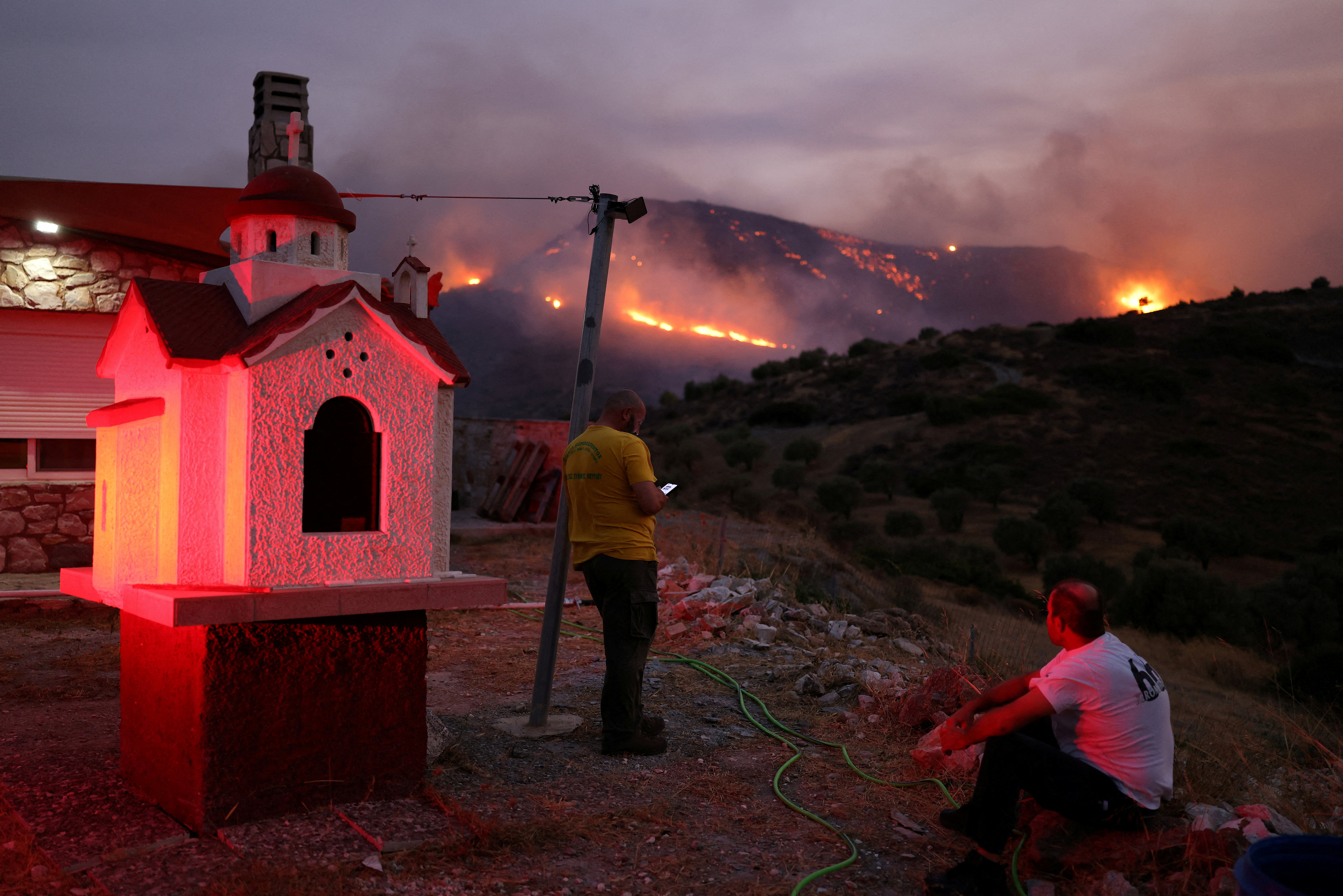 FILE PHOTO: Wildfire burns in Keratea, near Athens