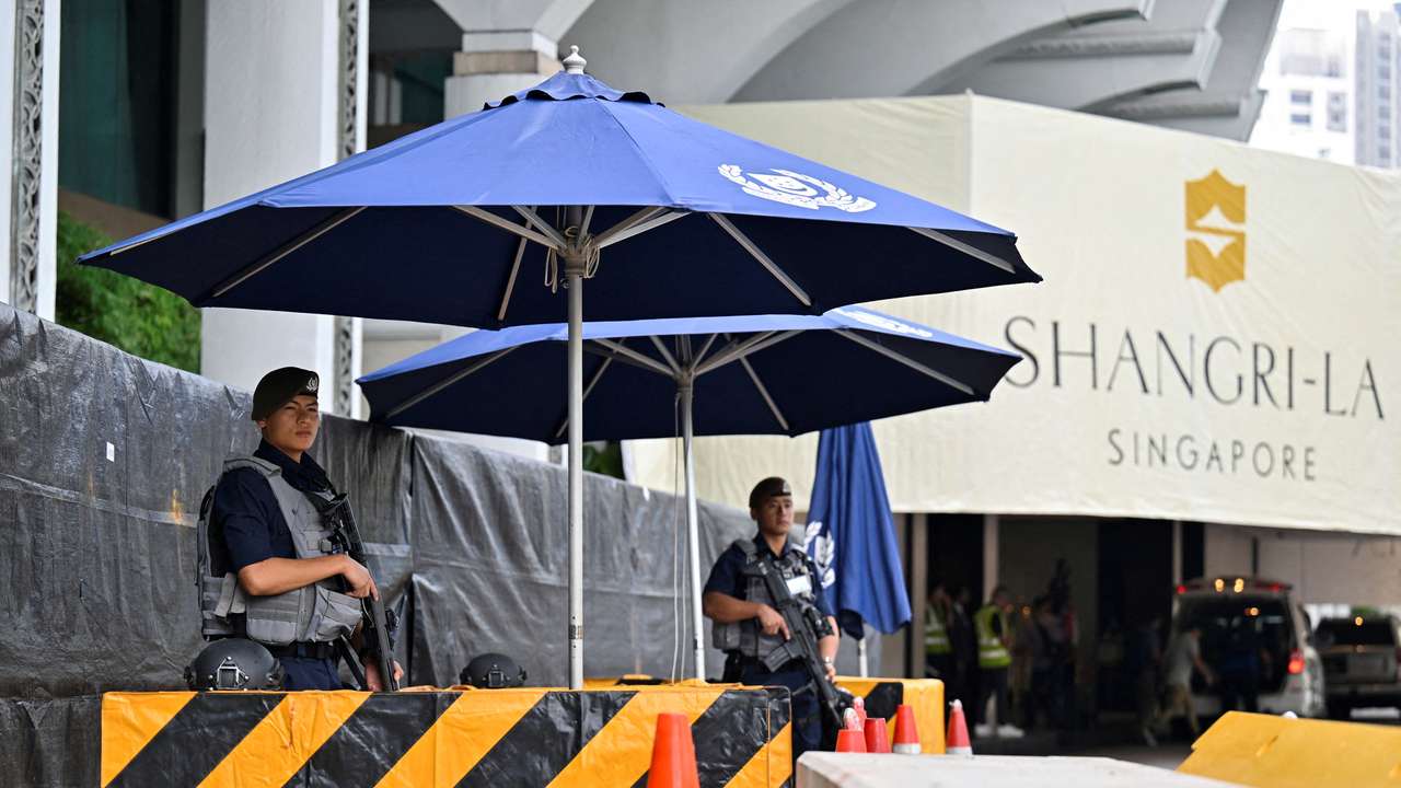 FILE PHOTO: Gurkhas stand guard at the entrance of the venue of the 20th Shangri-La Dialogue in Singapore