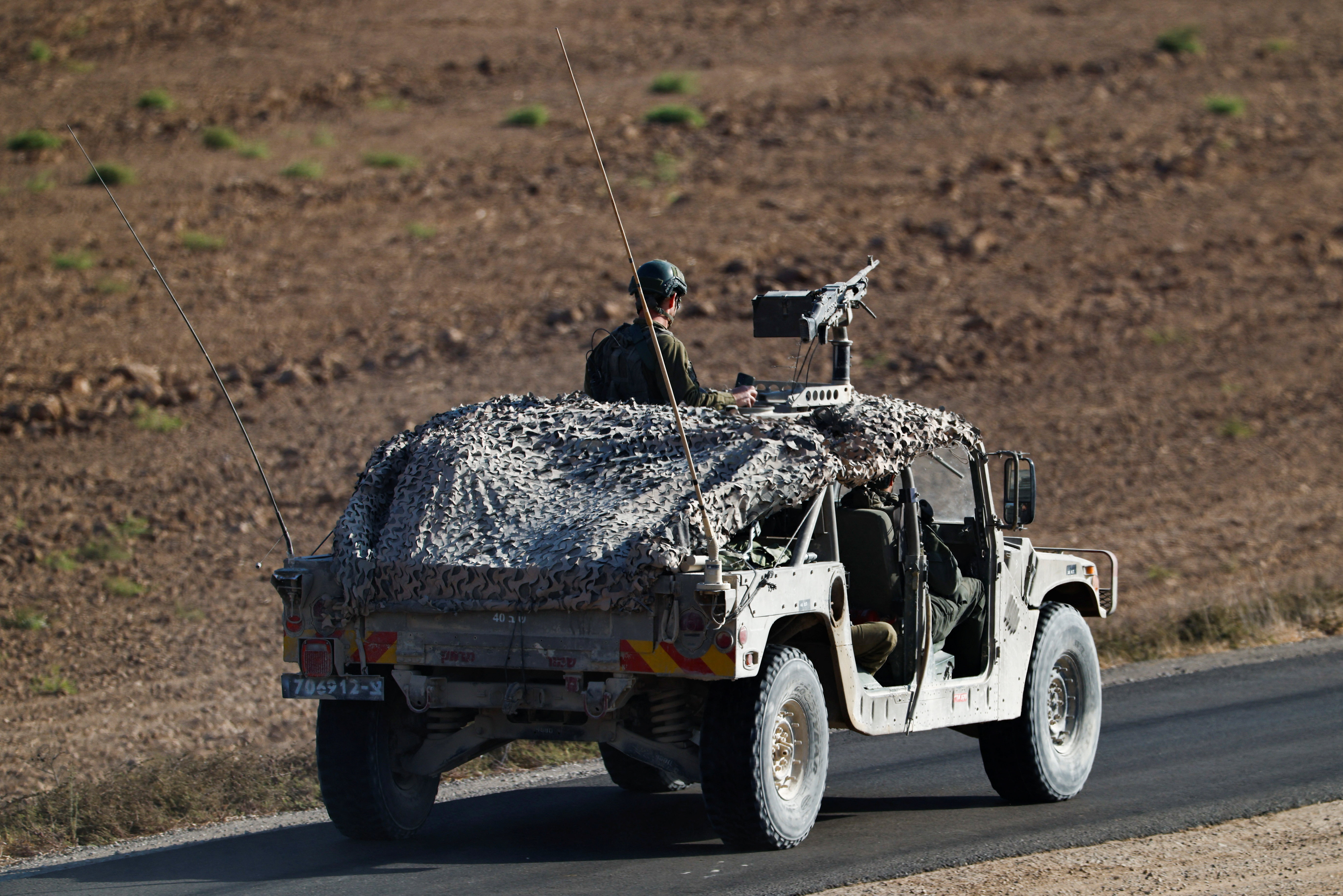 A military vehicle manoeuvres on Israeli side of the Israel-Gaza border