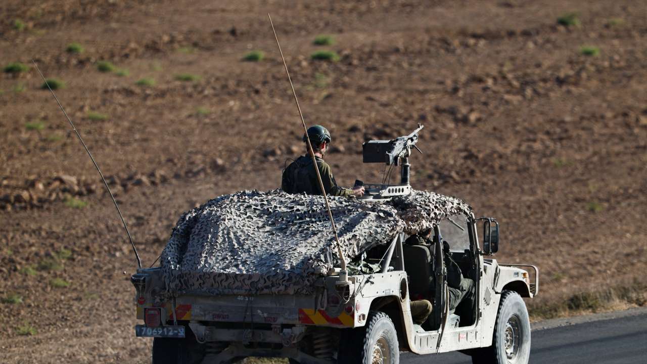 A military vehicle manoeuvres on Israeli side of the Israel-Gaza border