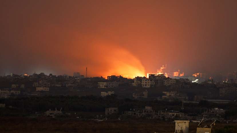 FILE PHOTO: Fire burns in north Gaza, amid the ongoing conflict between Israel and the Palestinian Islamist group Hamas, as seen from Israel