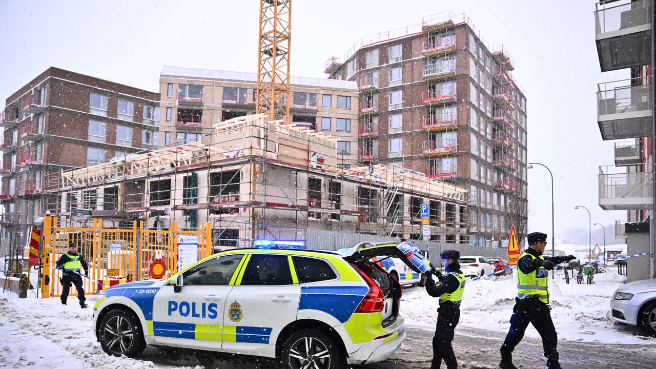 Police officers work following a construction elevator accident in Sundbyberg, north of Stockholm