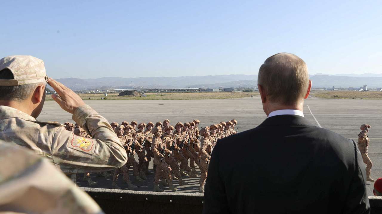 FILE PHOTO: Russian President Putin and Defence Minister Shoigu visit the Hmeymim air base in Latakia Province