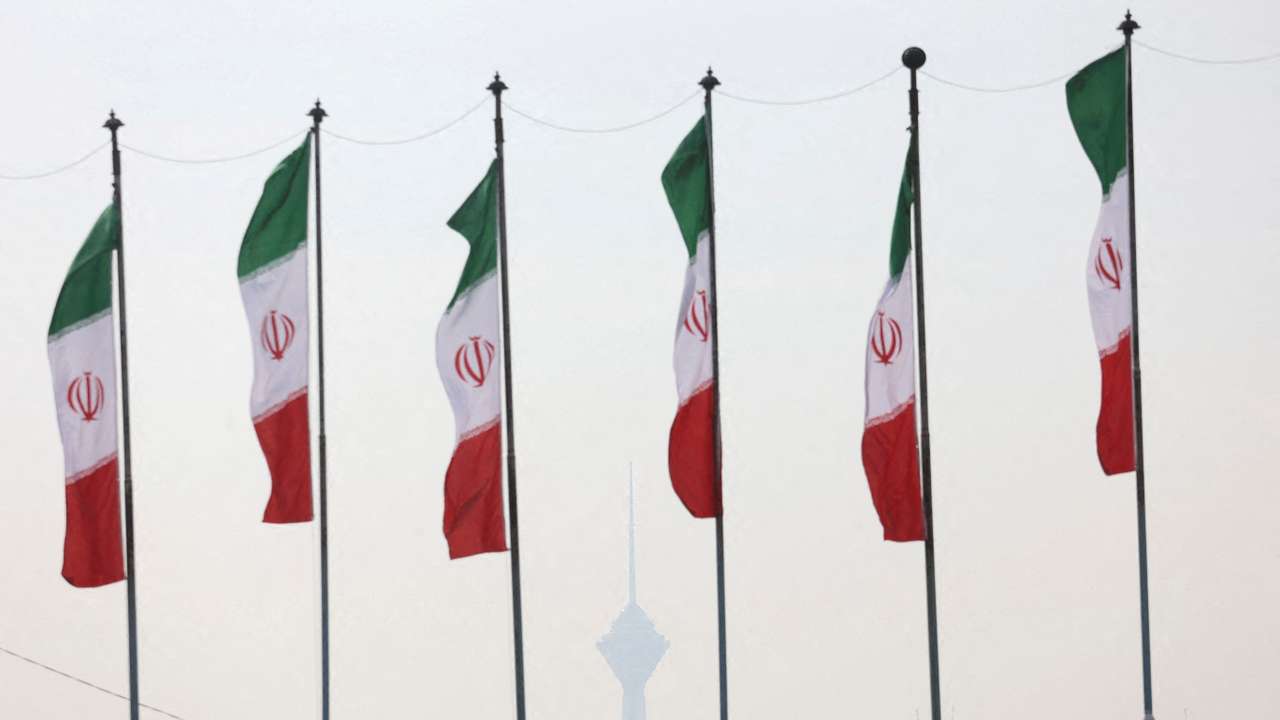 FILE PHOTO: Iranian flags flutter as the Milad Tower is covered in smog following the increase in air pollution in Tehran