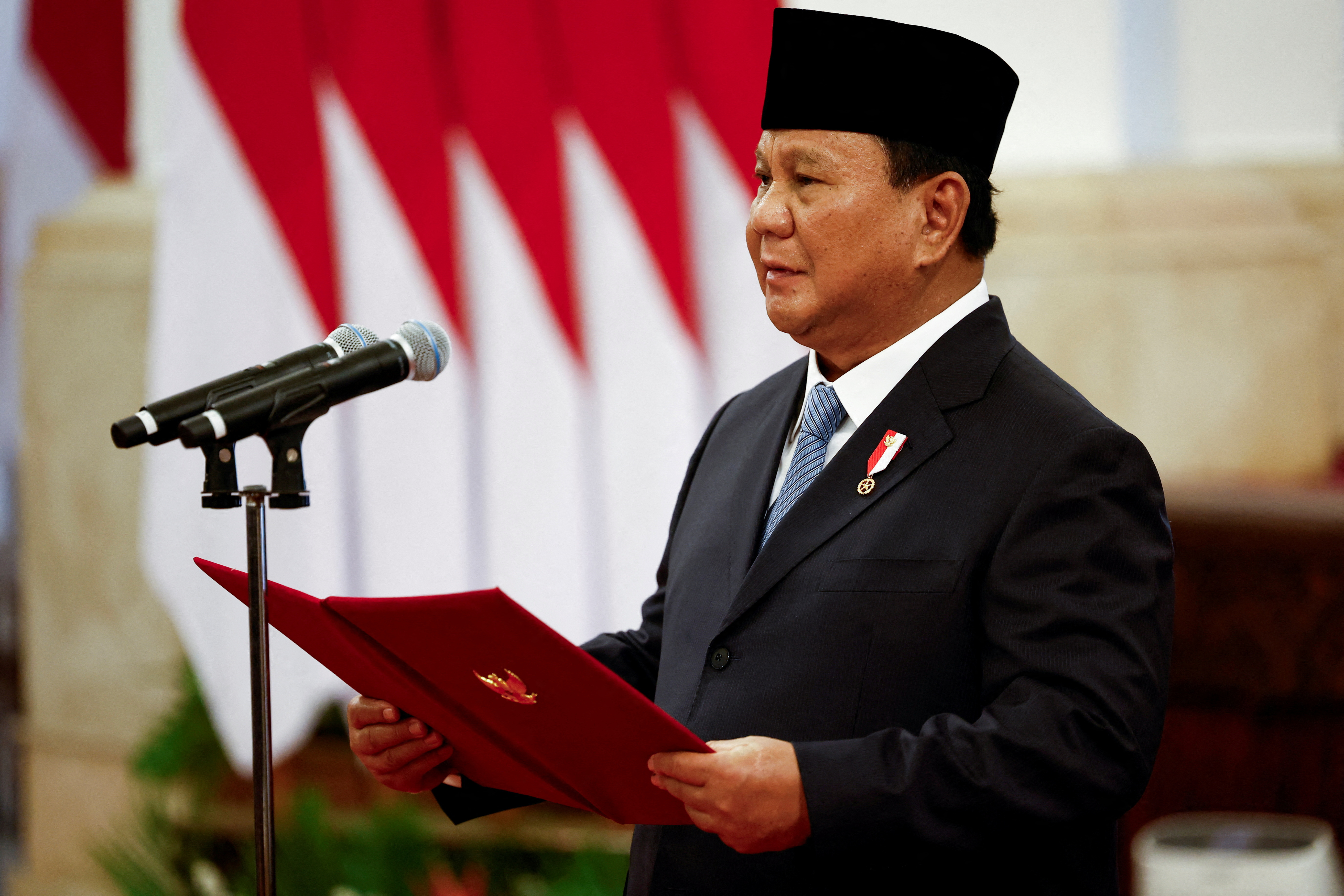 FILE PHOTO: Indonesia's new president Prabowo Subianto inaugurates his cabinet ministers in Jakarta