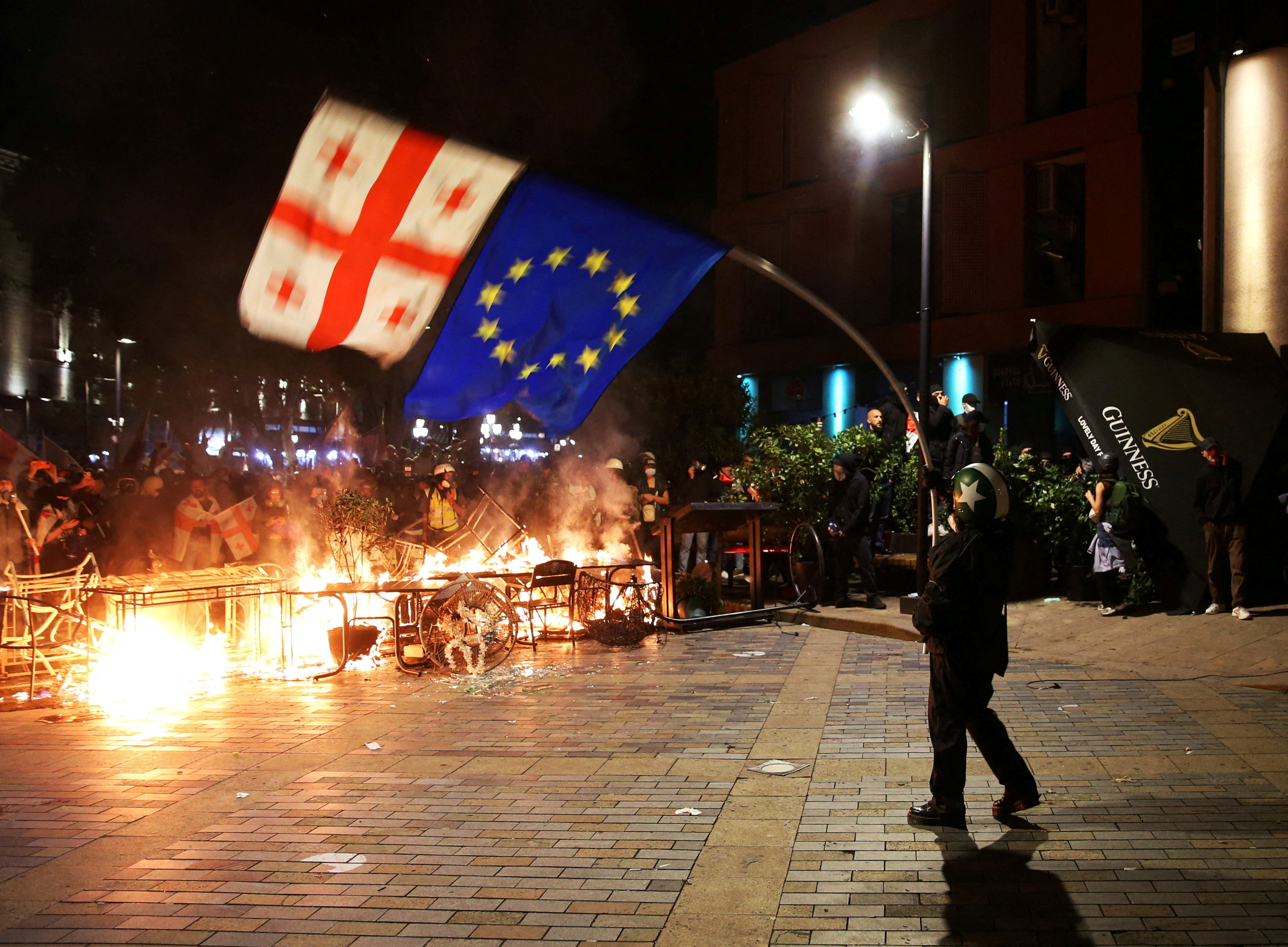 FILE PHOTO: Opposition supporters hold a rally on the day of local elections in Tbilisi