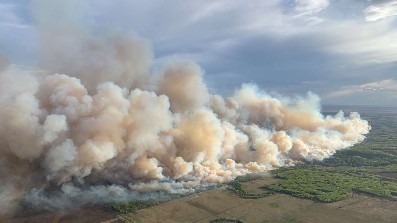 Smoke rises from mutual aid wildfire GCU007 in the Grande Prairie Forest Area