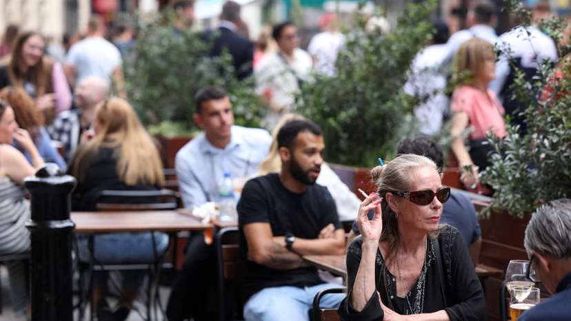 Woman smokes outdoors in London