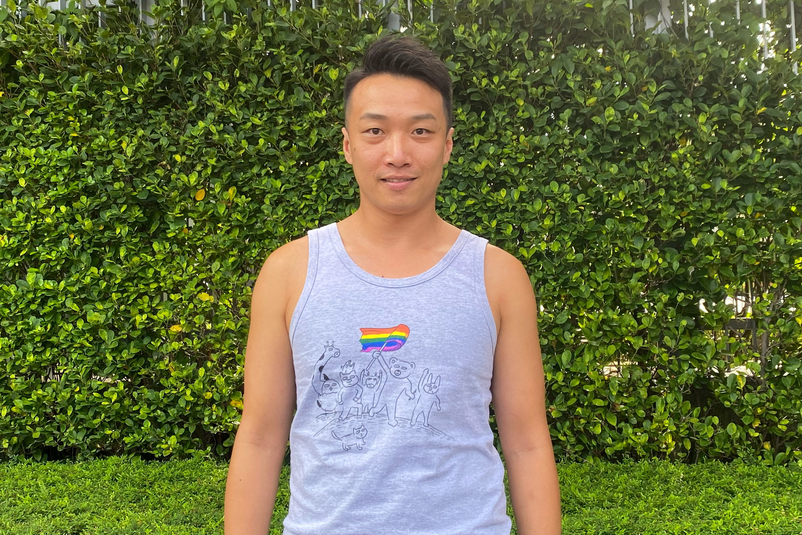 LGBTQ activist Jimmy Sham poses for photos outside the Legislative Council Complex in Hong Kong