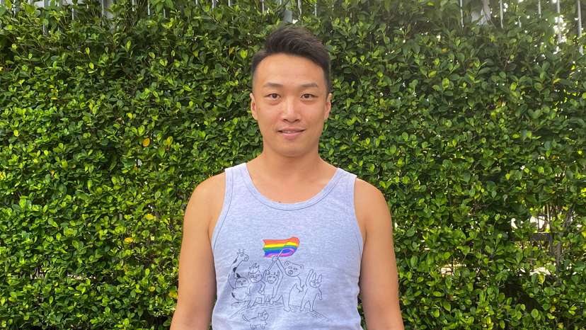 LGBTQ activist Jimmy Sham poses for photos outside the Legislative Council Complex in Hong Kong