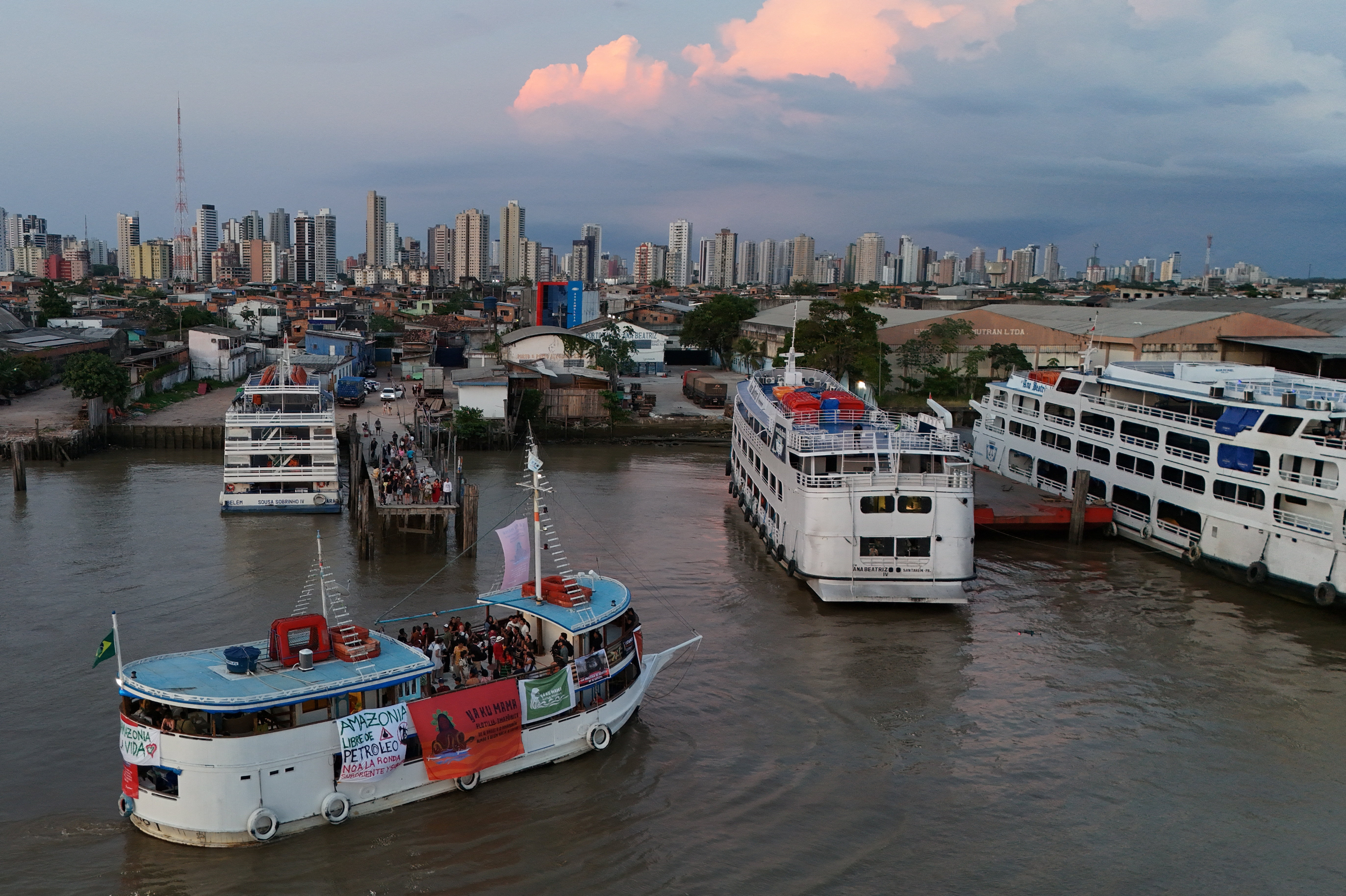 Indigenous flotilla arrives for COP30 climate summit, in Belem