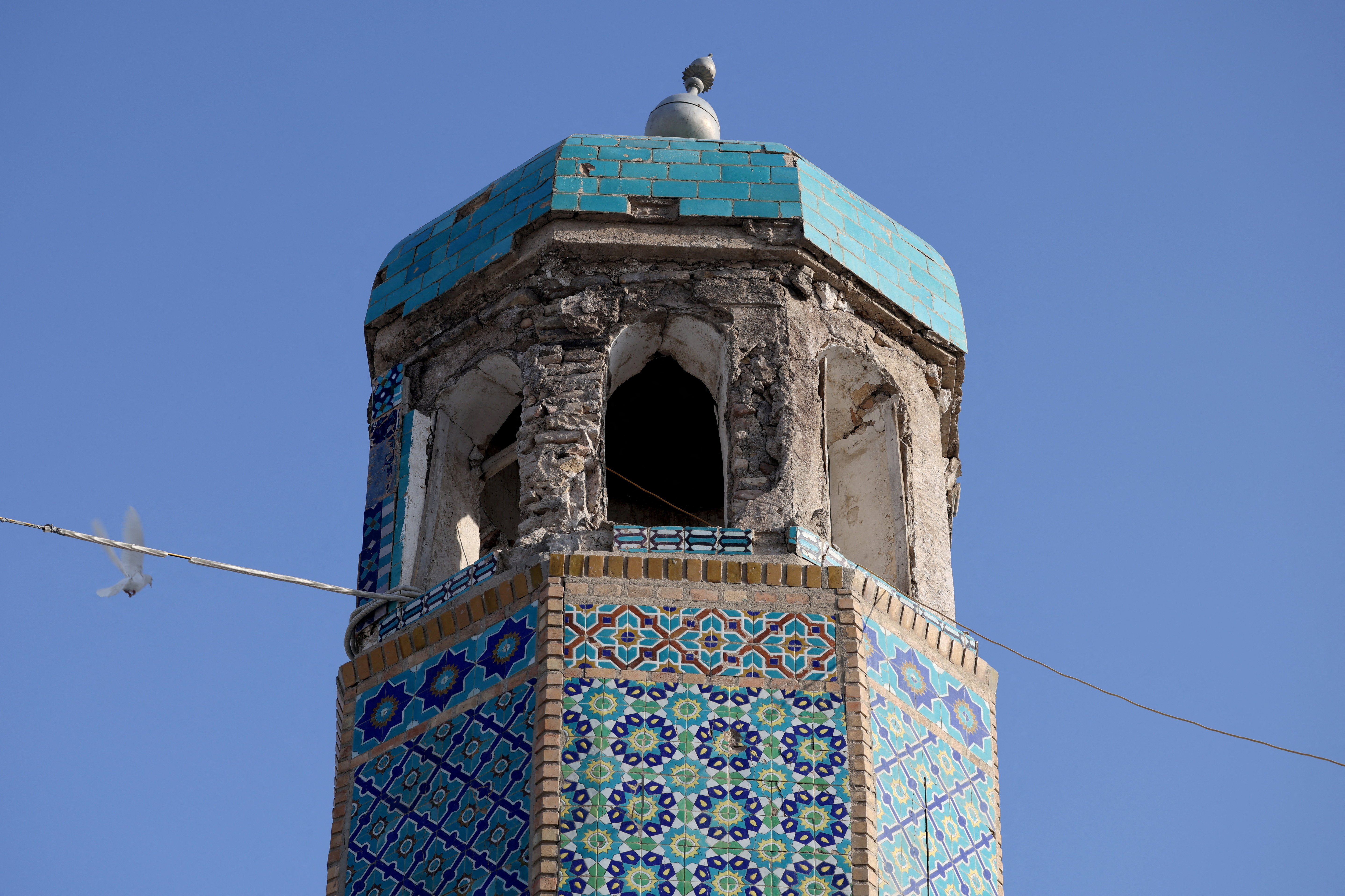 A damaged minaret of the Blue Mosque after the mosque sustained minor damage following a recent earthquake in Mazar-i-Sharif